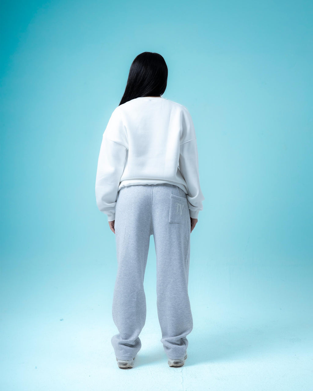 White Crewneck and Light Grey Pants